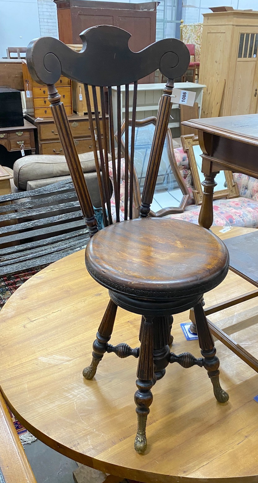 A 19th century French walnut harpist chair, with bronze feet